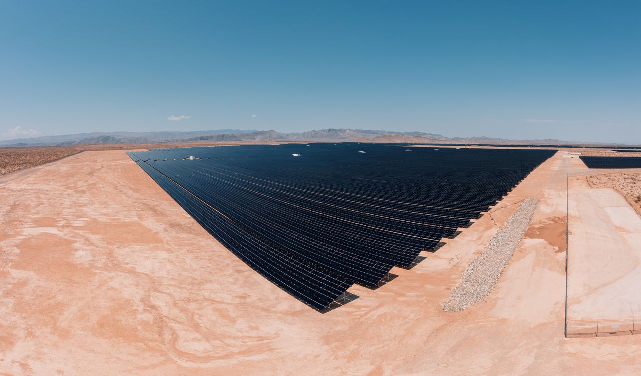 Aerial view of a large solar farm in a desert setting